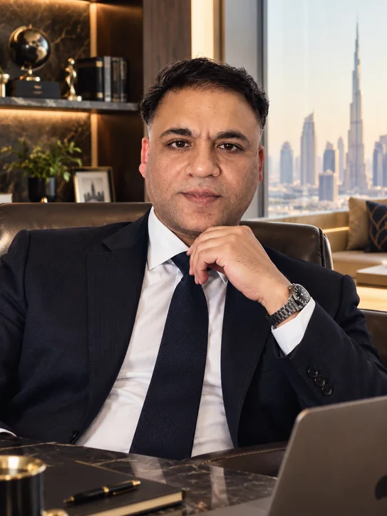 Liju Abdul Karim in his office above the Dubai skyline at dusk